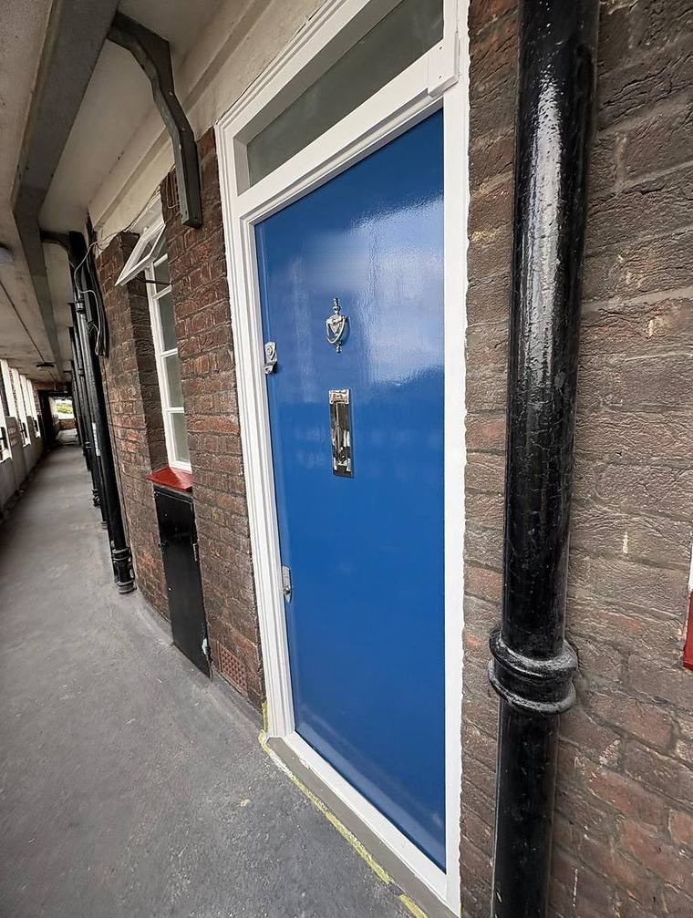 The refurbished front door to the flat