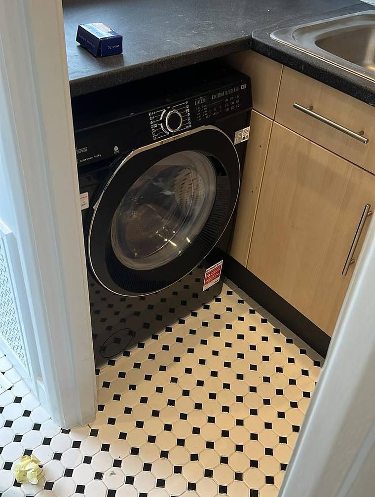 The kitchen with integrated oven and washing machine