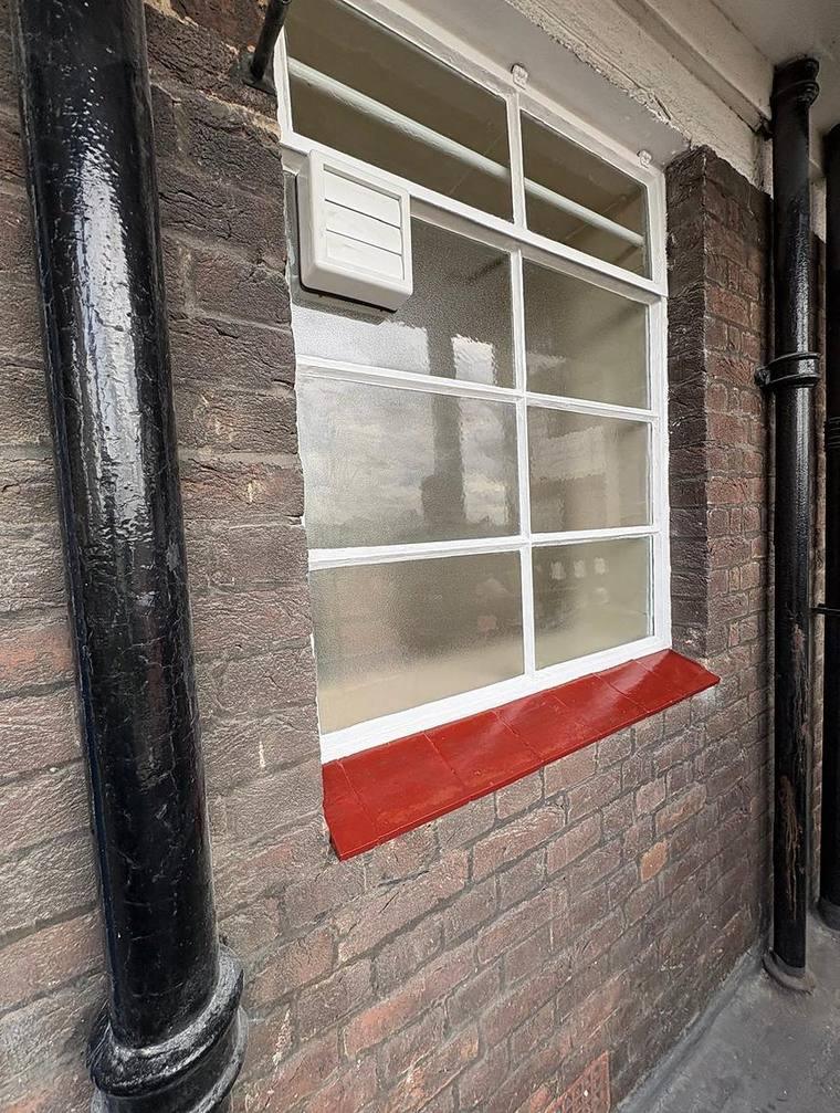 Repaired and redecorated window and sill
