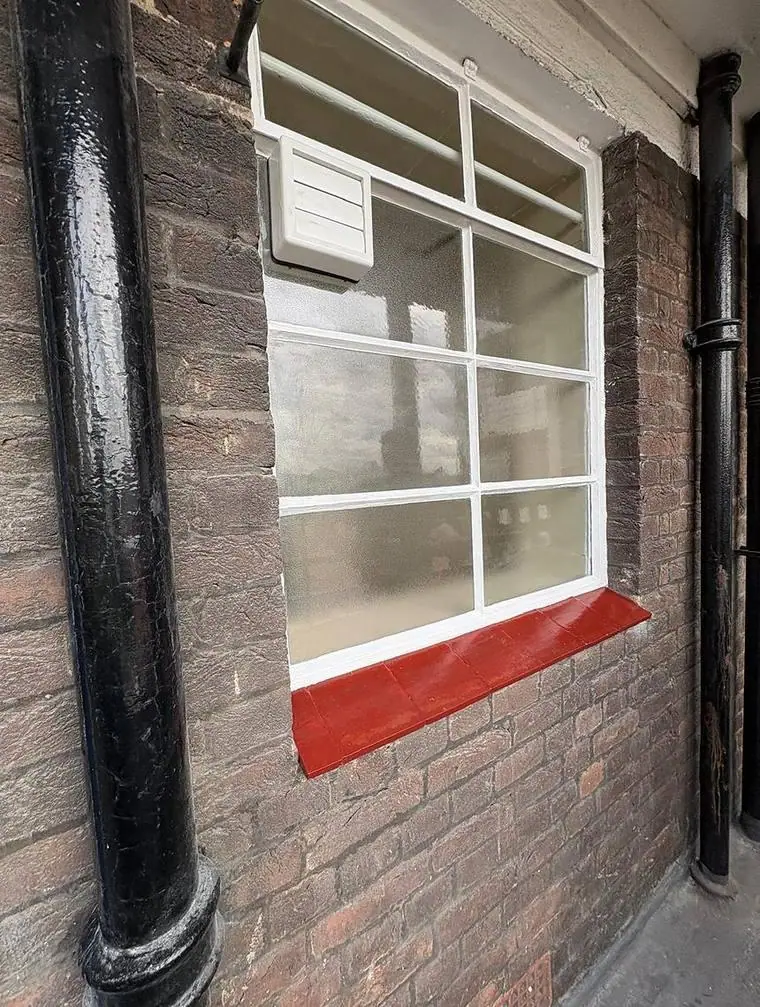 Repaired and redecorated window and sill