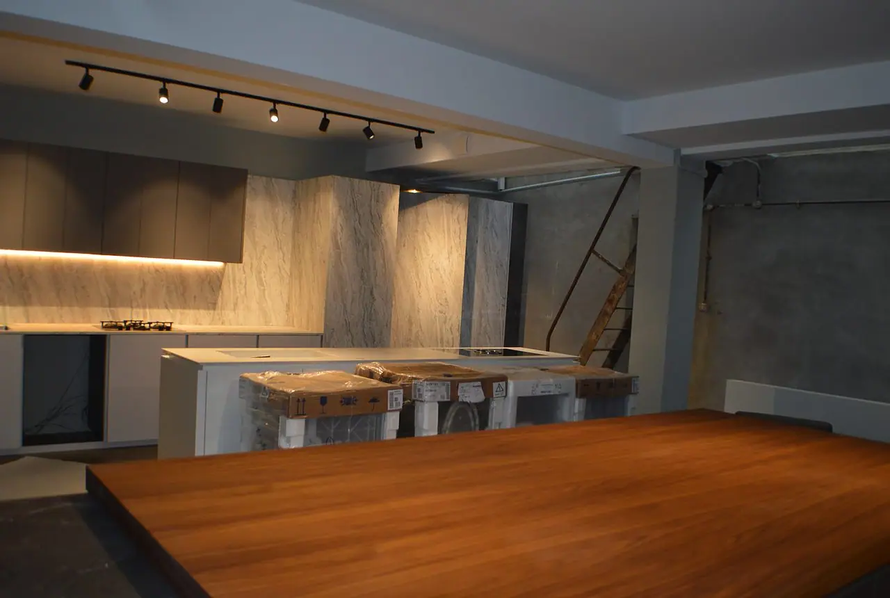 The showroom floor with dining display and feature lighting