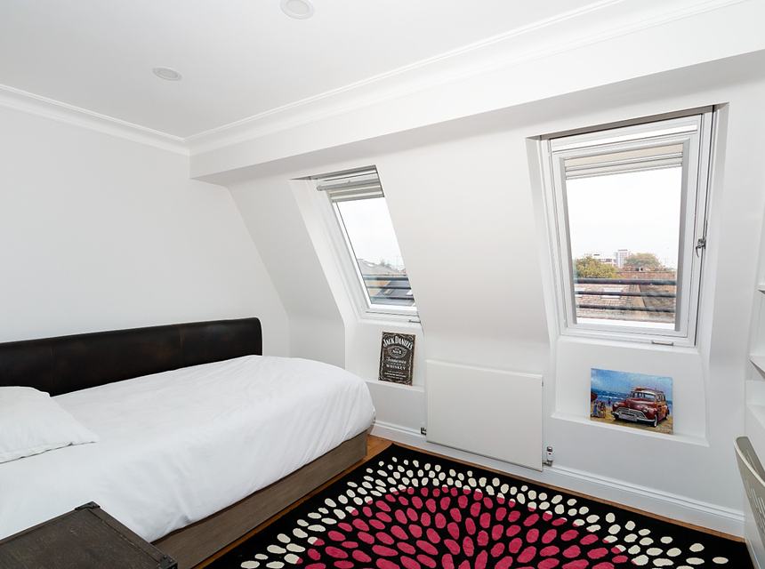 A finished bedroom under the new roof