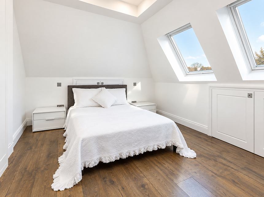 A finished loft bedroom with rooflights