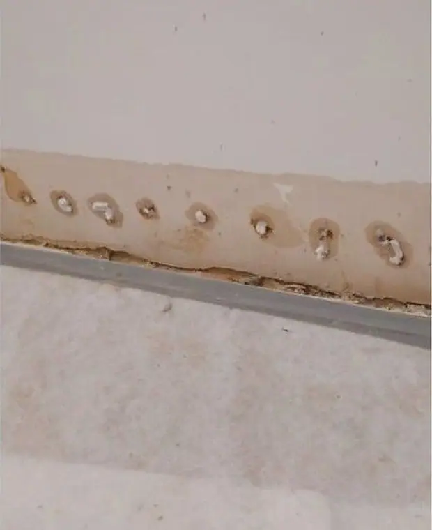 Damp proof membrane fixed to a basement wall